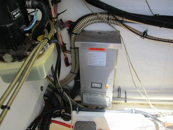 Slide: The Image of 1997 Formula 382 FASTech engine compartment with Pro Mariner 50 battery charger. - 32