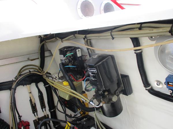 Slide: The Image of Engine compartment of a 1997 Formula 382 FASTech boat showing wiring and components. - 33
