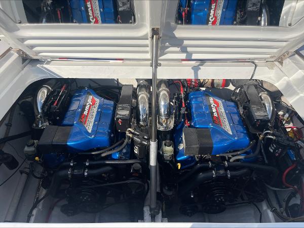 Slide: The Image of 1997 Formula 382 FASTech boat engine compartment with twin Mercury engines. - 34