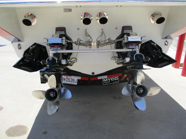 Slide: The Image of 1997 Formula 382 FASTech boat stern with dual propellers and Myco trailer. - 7