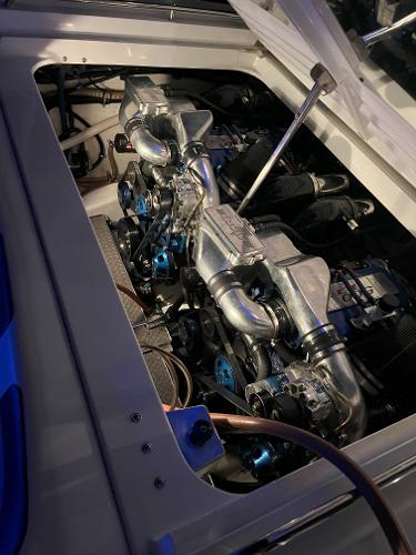Slide: The Image of Engine compartment of a 2000 Formula 382 FASTech boat, showcasing dual engines and metallic components. - 10