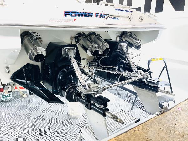 Slide: The Image of 2000 Formula 382 FASTech boat with dual outboard engines and polished exhausts. - 11