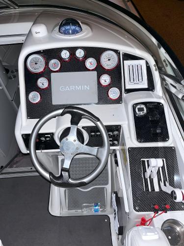 Slide: The Image of Cockpit of 2000 Formula 382 FASTech with Garmin navigation and carbon fiber dashboard. - 12