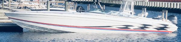 Slide: The Image of 2000 Formula 382 FASTech speedboat docked on calm water. - 17