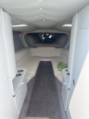 Slide: The Image of Interior of a 2000 Formula 382 FASTech boat, featuring white seating and modern design. - 20