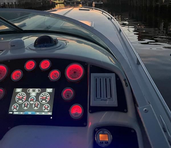 Slide: The Image of Cockpit view of 2000 Formula 382 FASTech boat with illuminated gauges at dusk. - 22