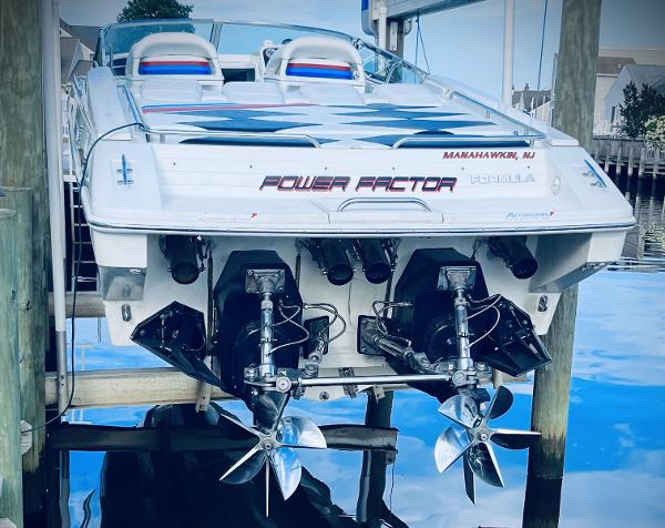 Slide: The Image of 2000 Formula 382 FASTech boat with dual propellers docked at marina. - 5