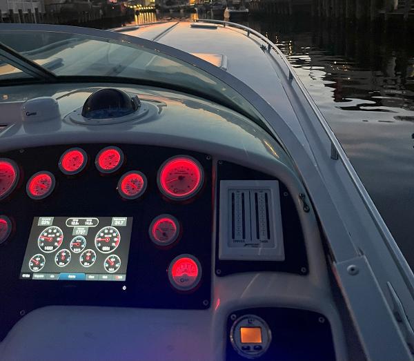 Slide: The Image of Dashboard of a 2000 Formula 382 FASTech boat with illuminated gauges at dusk. - 8