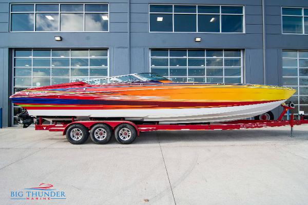 Slide: The Image of 2012 Formula 382 FASTech speedboat on a red trailer outside Big Thunder Marine. - 0