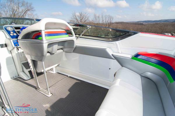 Slide: The Image of 2012 Formula 382 FASTech boat interior with colorful seating and dashboard. - 14