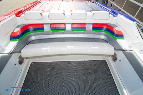 Slide: The Image of 2012 Formula 382 FASTech boat interior with colorful seating and deck. - 16