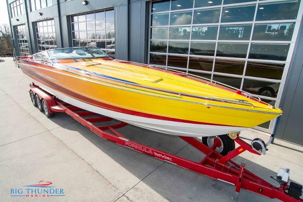 Slide: The Image of 2012 Formula 382 FASTech speedboat on a red trailer at Big Thunder Marine. - 2