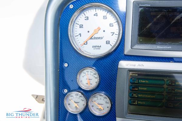 Slide: The Image of Close-up of 2012 Formula 382 FASTech dashboard with gauges and navigation system. - 21
