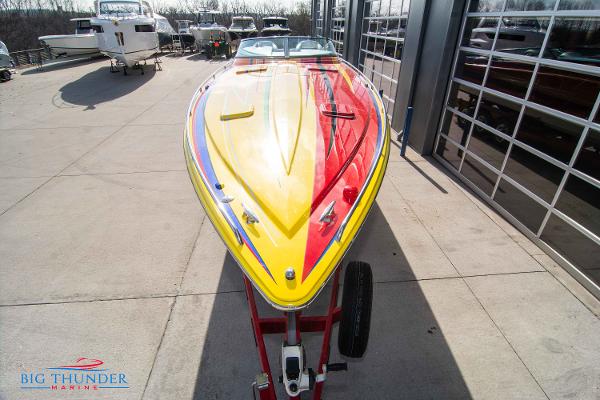 Slide: The Image of 2012 Formula 382 FASTech speedboat with vibrant yellow and red design at Big Thunder Marine. - 3