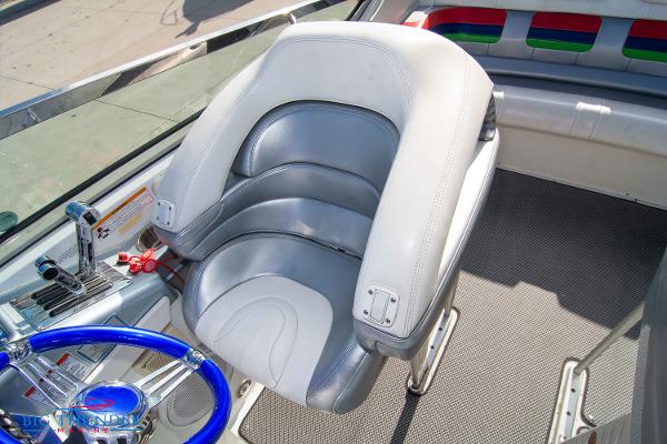 Slide: The Image of Captain's seat of a 2012 Formula 382 FASTech boat with silver and white upholstery. - 31