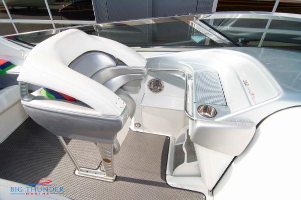 Slide: The Image of 2012 Formula 382 FASTech boat cockpit with helm seat and controls. - 39