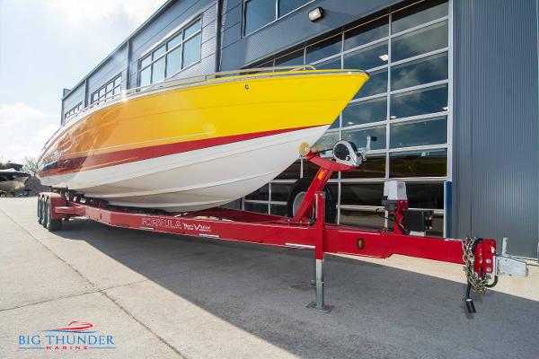 Slide: The Image of 2012 Formula 382 FASTech boat on red trailer outside Big Thunder Marine. - 4