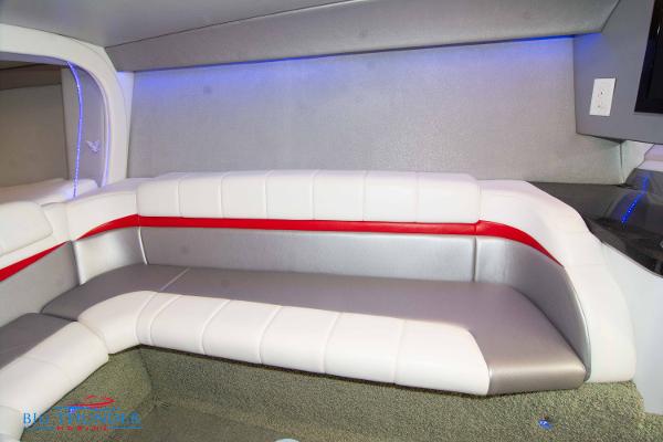 Slide: The Image of Interior seating of a 2012 Formula 382 FASTech boat with white and red upholstery. - 45