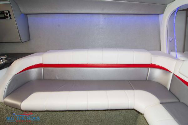 Slide: The Image of Interior seating of a 2012 Formula 382 FASTech boat with white and red upholstery. - 46