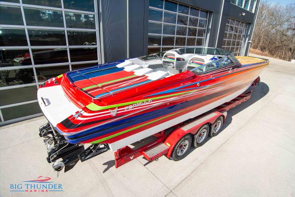 Slide: The Image of 2012 Formula 382 FASTech speedboat on a red trailer at Big Thunder Marine. - 6