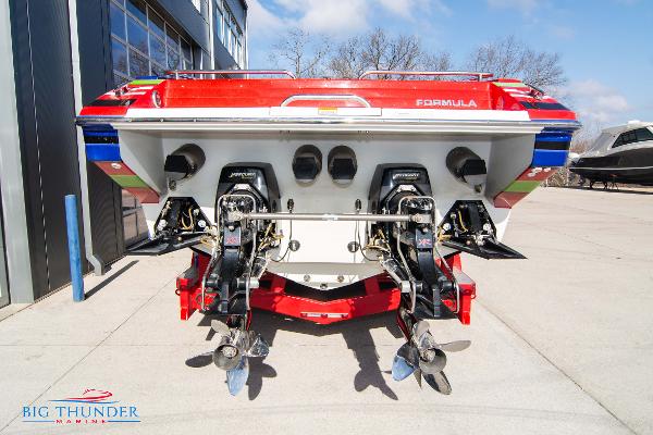 Slide: The Image of 2012 Formula 382 FASTech boat rear view with dual outboard motors. - 7