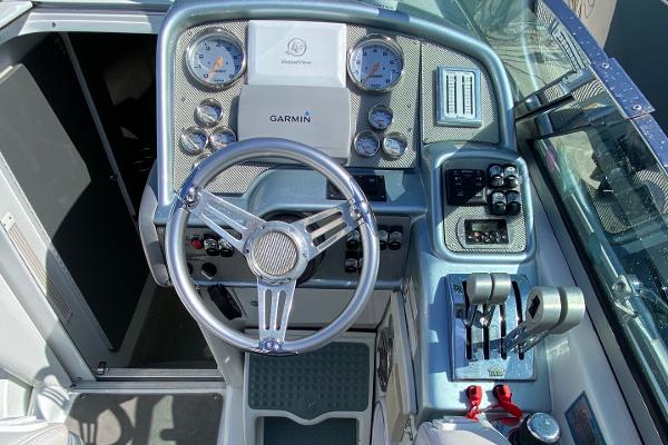 Slide: The Image of 2013 Formula 382 FASTech boat cockpit with Garmin navigation system and control panel. - 10