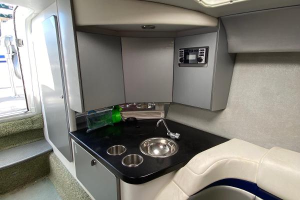 Slide: The Image of 2013 Formula 382 FASTech boat interior with kitchenette and seating area. - 14