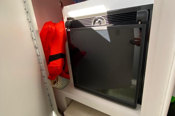 Slide: The Image of 2013 Formula 382 FASTech cabin with mini fridge and life jackets. - 17