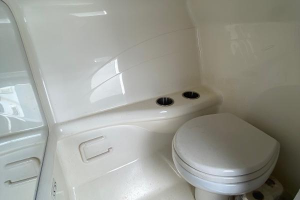 Slide: The Image of 2013 Formula 382 FASTech boat bathroom with toilet and cup holders. - 18