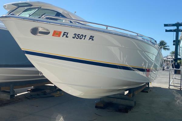 Slide: The Image of 2013 Formula 382 FASTech boat on dry dock with registration FL 3501 PL. - 2