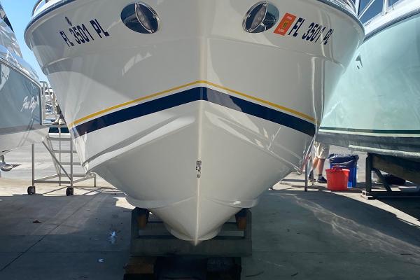 Slide: The Image of 2013 Formula 382 FASTech boat on a trailer in a marina. - 3