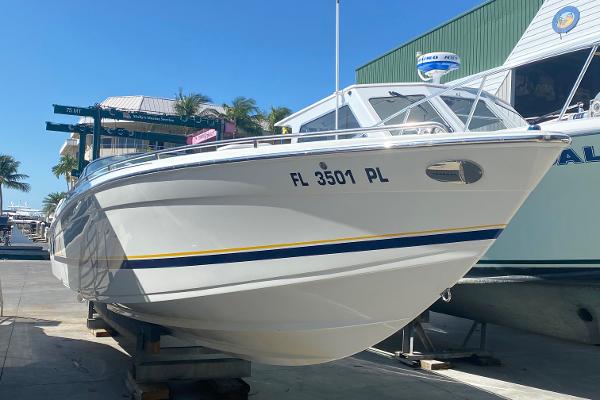 Slide: The Image of 2013 Formula 382 FASTech boat docked at a marina. - 4