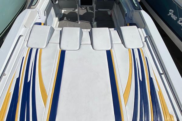Slide: The Image of 2013 Formula 382 FASTech boat with white, blue, and yellow upholstery. - 6