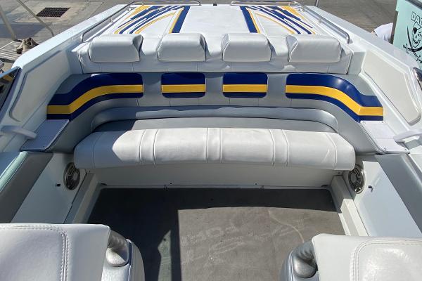 Slide: The Image of 2013 Formula 382 FASTech boat interior with white, blue, and yellow seating. - 7