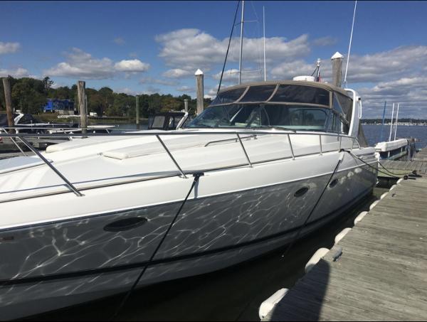 Slide: The Image of 2000 Formula 41 PC yacht docked at a marina on a sunny day. - 1