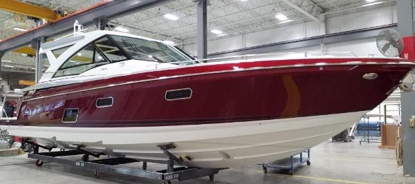 Slide: The Image of 2020 Formula 430 Super Sport Crossover boat in a warehouse. - 1