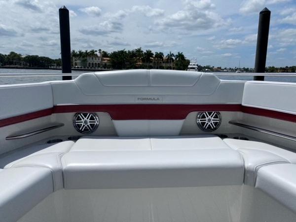 Slide: The Image of 2020 Formula 430 Super Sport Crossover boat interior with white and red seating. - 10