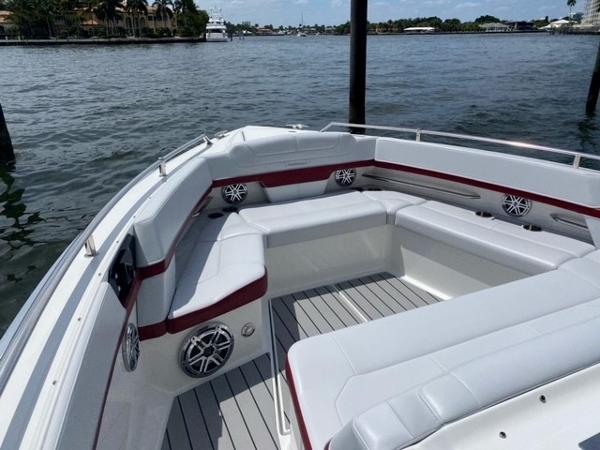 Slide: The Image of 2020 Formula 430 Super Sport Crossover boat with spacious seating on the water. - 11