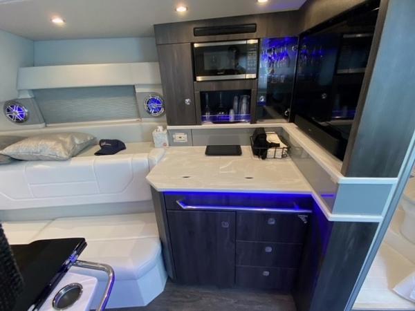 Slide: The Image of Interior of 2020 Formula 430 Super Sport Crossover yacht with modern kitchen and seating area. - 18