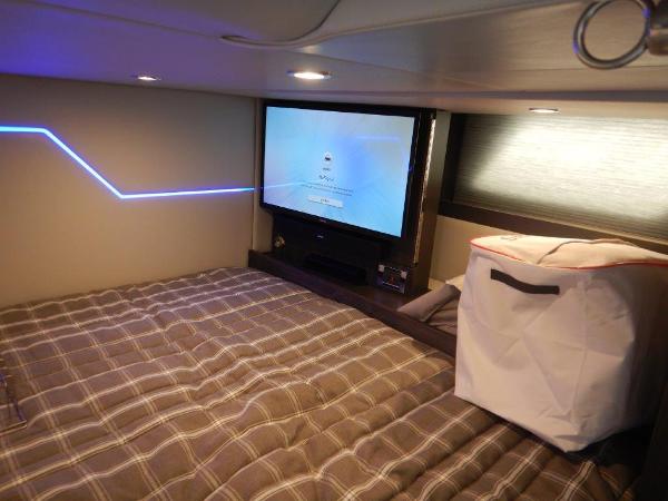 Slide: The Image of 2020 Formula 430 Super Sport Crossover cabin with bed, TV, and storage. - 21