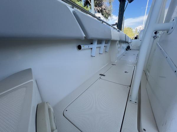 Slide: The Image of 2008 Fountain 34 CC boat interior with rod holders and clean deck. - 29