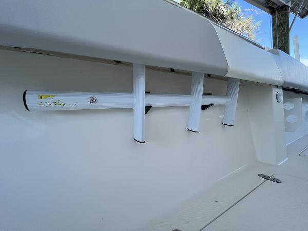 Slide: The Image of 2008 Fountain 34 CC boat interior with rod holders and sleek design. - 31