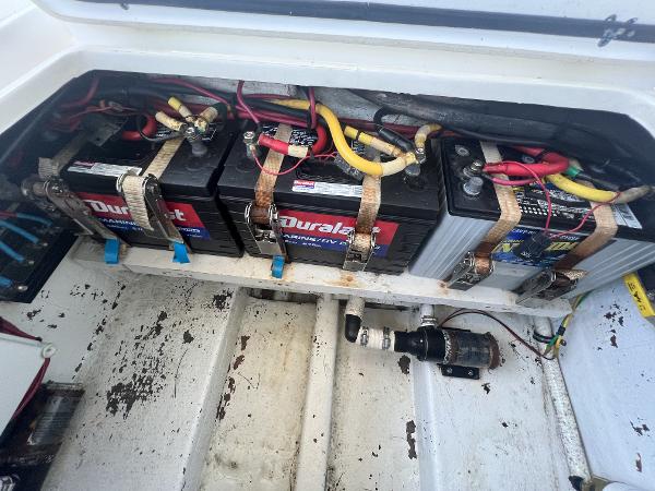 Slide: The Image of Battery compartment of a 2008 Fountain 34 CC boat with Duralast batteries. - 41