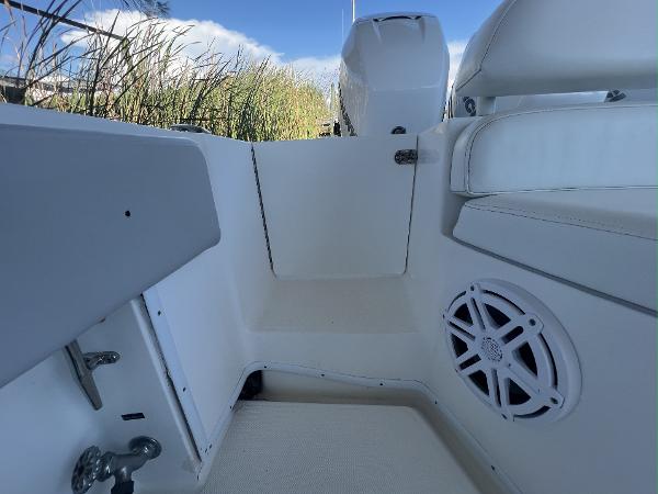 Slide: The Image of Interior view of a 2008 Fountain 34 CC boat, featuring seating and speaker. - 7