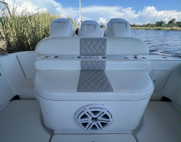 Slide: The Image of 2008 Fountain 34 CC boat seating with speaker, on calm water. - 8