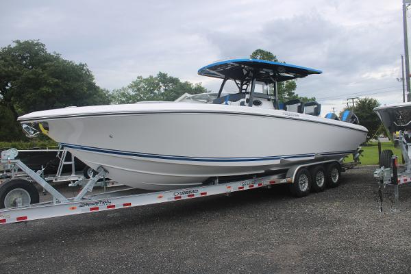 Slide: The Image of 2024 Fountain 34 SC boat on a trailer, side view. - 0