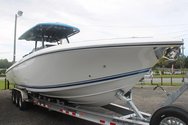 Slide: The Image of 2024 Fountain 34 SC boat on a trailer, side view. - 1