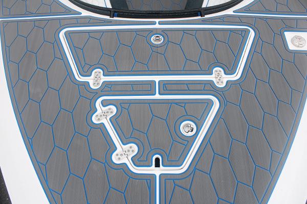 Slide: The Image of 2024 Fountain 34 SC boat deck with blue and gray hexagonal pattern. - 11