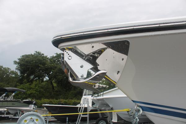 Slide: The Image of 2024 Fountain 34 SC boat bow with anchor, docked outdoors. - 16