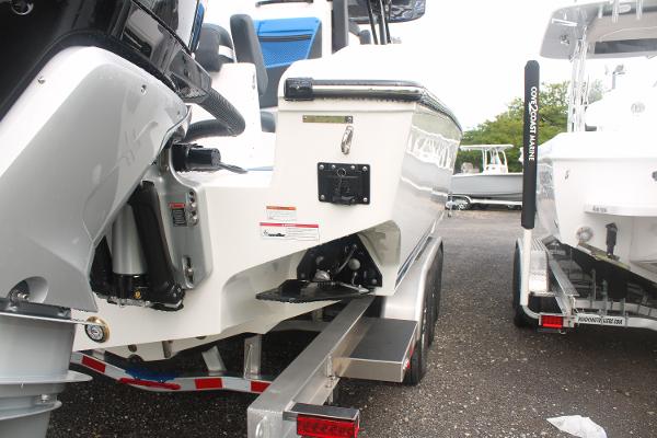 Slide: The Image of 2024 Fountain 34 SC boat on a trailer, rear view showing outboard motor and hull. - 19